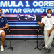 Lewis Hamilton and George Russell sit in a press conference.